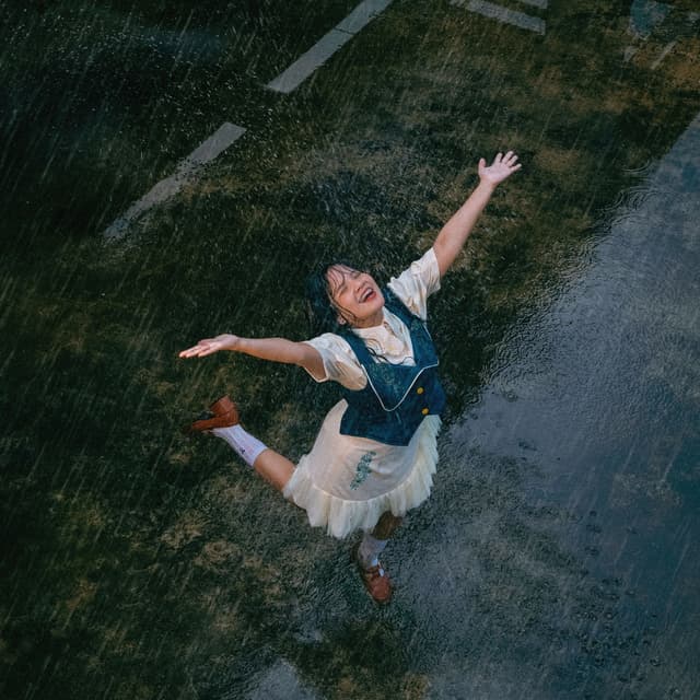 Album cover art for Berusaha di Bawah Hujan