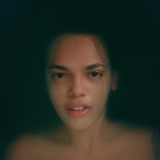 Album cover art for At What Cost